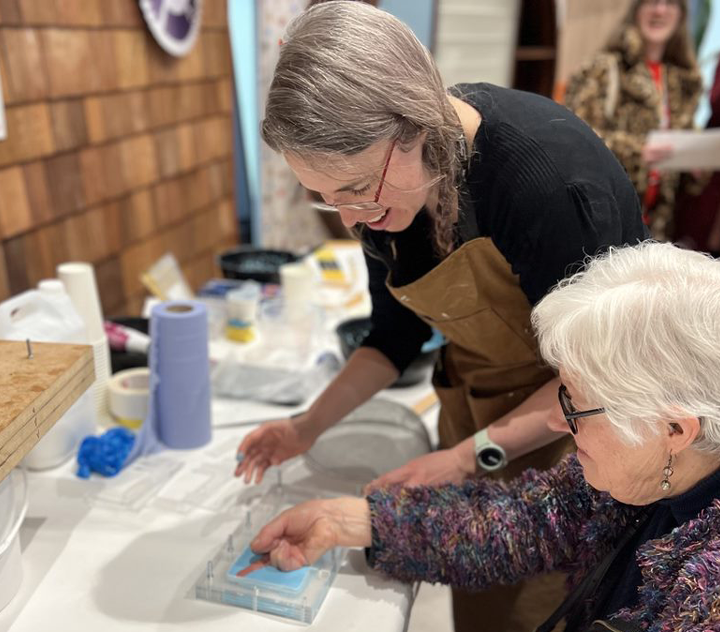 Rosie casting a tile of a womans hand